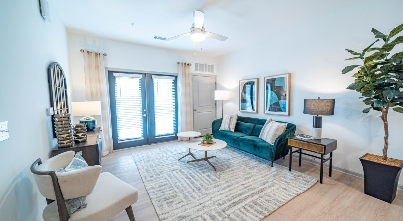 Spacious living room layout in Indian Land SC apartments with upscale interior design.